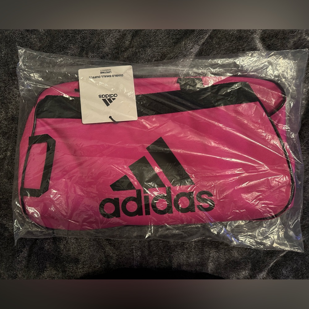 046 NWT Adidas Diablo small duffel.  Pink and black. Brand new in package.